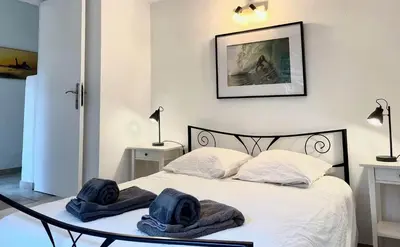 Un ou plusieurs lits dans un hébergement de l'établissement Appartement La Gravière