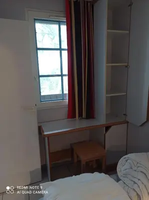 Un ou plusieurs lits dans un hébergement de l'établissement Duplex entre forêt et océan - Chez Alex & Max
