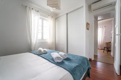 Un ou plusieurs lits dans un hébergement de l'établissement Villa Amandine - Charmante maison de famille au Pyla