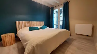 Un ou plusieurs lits dans un hébergement de l'établissement Confortable Landaise avec piscine privée proche lac et golf
