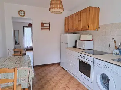 Cuisine ou kitchenette dans l'établissement Cigale