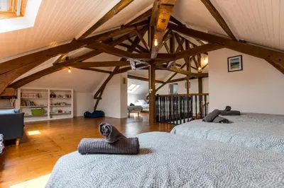 Un ou plusieurs lits dans un hébergement de l'établissement La villa de saint lon