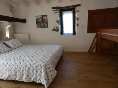Un ou plusieurs lits dans un hébergement de l'établissement La maison du becq