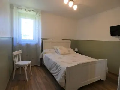Un ou plusieurs lits dans un hébergement de l'établissement La maison du becq