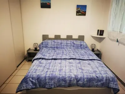 Un ou plusieurs lits dans un hébergement de l'établissement Agréable T2 avec Piscine et Parking à Soustons - FR-1-379-165