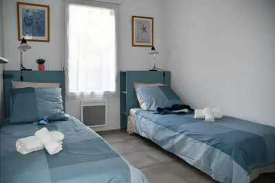 Un ou plusieurs lits dans un hébergement de l'établissement Appartement T3 (plain-pied) et son jardin privatif clos à Vieux Boucau