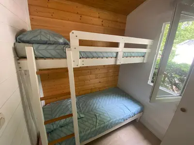 Un ou plusieurs lits dans un hébergement de l'établissement Le chalet Arcachonais