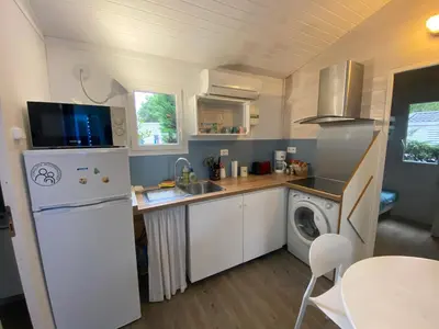 Cuisine ou kitchenette dans l'établissement Le chalet Arcachonais