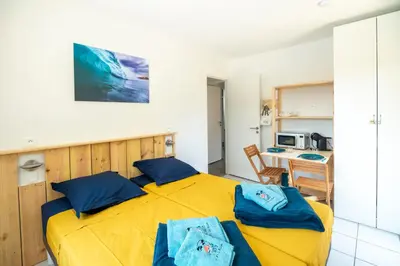 Un ou plusieurs lits dans un hébergement de l'établissement un Air de Repos