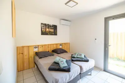 Un ou plusieurs lits dans un hébergement de l'établissement un Air de Repos