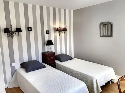 Un ou plusieurs lits dans un hébergement de l'établissement Maison la teste centre