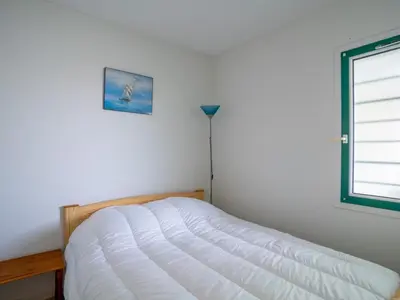 Un ou plusieurs lits dans un hébergement de l'établissement Appartement à Mimizan Plage pour 4 pers, face à l'océan, balcon, parking, ménage inclus - FR-1-50-120