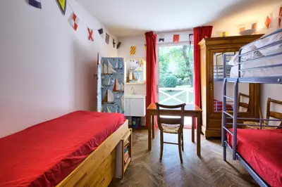 Un ou plusieurs lits dans un hébergement de l'établissement Villa Surprise