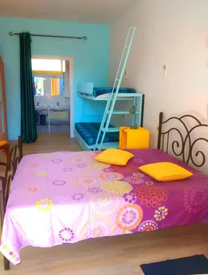 Un ou plusieurs lits dans un hébergement de l'établissement Gites et Chambres La colo du gave