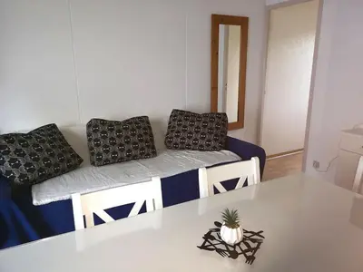 Coin salon dans l'établissement Charmante petite maison