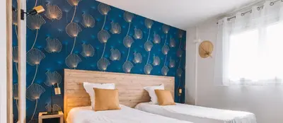 Un ou plusieurs lits dans un hébergement de l'établissement Hotel du Cap