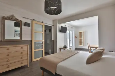 Un ou plusieurs lits dans un hébergement de l'établissement Hotel du Cap