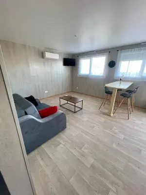 Coin salon dans l'établissement Appartement - location saisonnière
