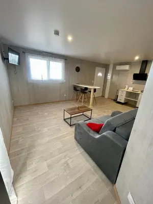Coin salon dans l'établissement Appartement - location saisonnière