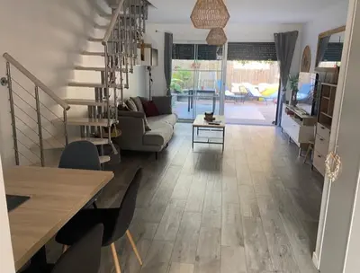 Coin salon dans l'établissement Maison, piscine centreville Gujan-Mestras 4 hôtes