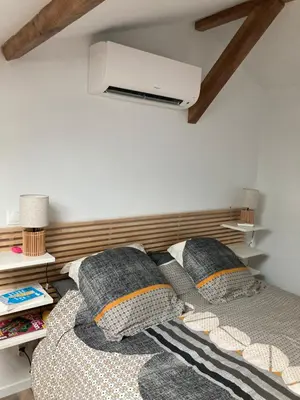 Un ou plusieurs lits dans un hébergement de l'établissement Appartement cosy avec grande terrasse