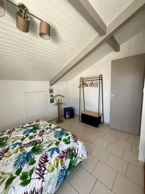 Un ou plusieurs lits dans un hébergement de l'établissement La Villa Louca - Charme, Soleil & Détente aux Portes des Landes