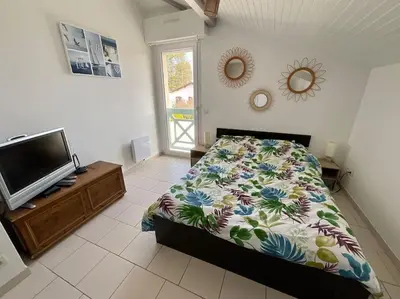Un ou plusieurs lits dans un hébergement de l'établissement La Villa Louca - Charme, Soleil & Détente aux Portes des Landes