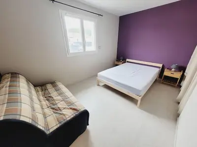 Un ou plusieurs lits dans un hébergement de l'établissement La Belle des bois