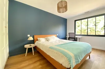 Un ou plusieurs lits dans un hébergement de l'établissement Villa neuve climatisée avec piscine chauffée