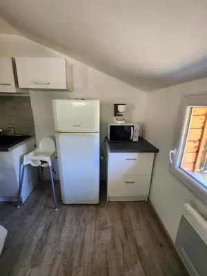 Cuisine ou kitchenette dans l'établissement Chalet au cœur des Landes