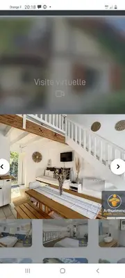 Télévision ou salle de divertissement dans l'établissement La maison près du Lac
