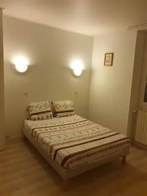 Un ou plusieurs lits dans un hébergement de l'établissement Auberge des Arènes