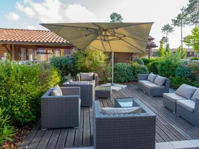 Coin salon dans l'établissement Holiday Home Les Cottages du Lac M3 Privilège by Interhome