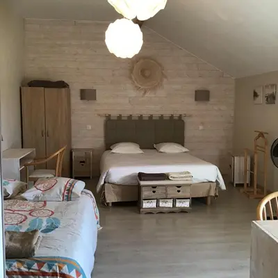 Un ou plusieurs lits dans un hébergement de l'établissement Chambre d'hôtes Maison des 5 Fleurs