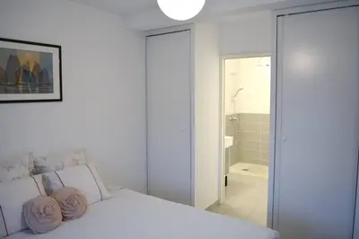 Un ou plusieurs lits dans un hébergement de l'établissement Appartement charmant à la Teste de Buch