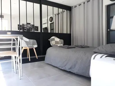 Un ou plusieurs lits dans un hébergement de l'établissement L'atelier d'Adrien