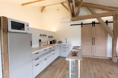 Cuisine ou kitchenette dans l'établissement L'Aparté