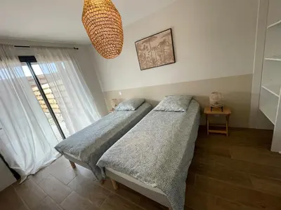 Un ou plusieurs lits dans un hébergement de l'établissement Vue Mer - Au Coeur de Contis Plage