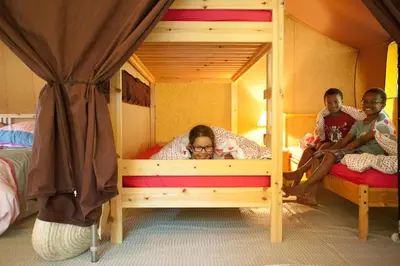 Un ou plusieurs lits dans un hébergement de l'établissement Tente Lodge La Téouleyre