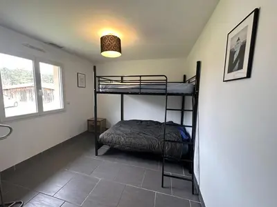 Un ou plusieurs lits dans un hébergement de l'établissement La villa lou miqueou