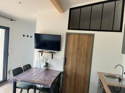 Télévision ou salle de divertissement dans l'établissement Location havre de paix