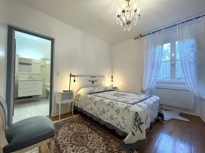 Un ou plusieurs lits dans un hébergement de l'établissement Le balcon des thermes