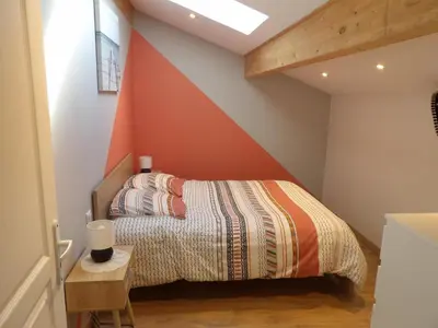 Un ou plusieurs lits dans un hébergement de l'établissement La villa du point du jour
