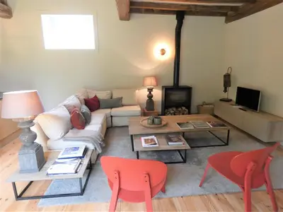Télévision ou salle de divertissement dans l'établissement Les ecuries du chateau