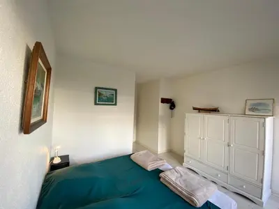 Un ou plusieurs lits dans un hébergement de l'établissement Appartement rénové pour 4 pers avec piscine à Capbreton - FR-1-413-230