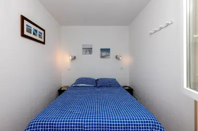 Un ou plusieurs lits dans un hébergement de l'établissement Blue Pinsolle - Appt avec piscine partagée