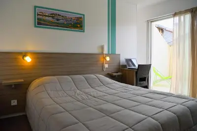 Un ou plusieurs lits dans un hébergement de l'établissement Hôtel Le Relais Dax