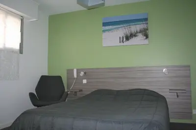Un ou plusieurs lits dans un hébergement de l'établissement Hôtel Le Relais Dax