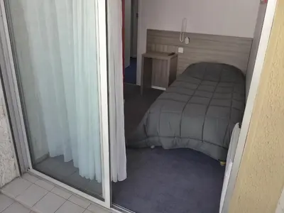 Un ou plusieurs lits dans un hébergement de l'établissement Hôtel Le Relais Dax
