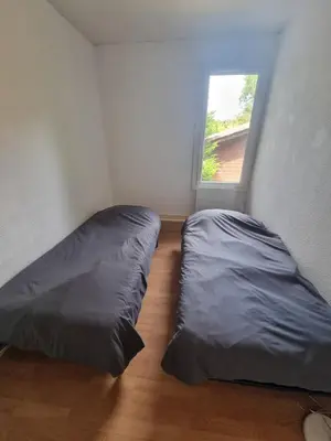 Un ou plusieurs lits dans un hébergement de l'établissement Maison vacances les fougères
